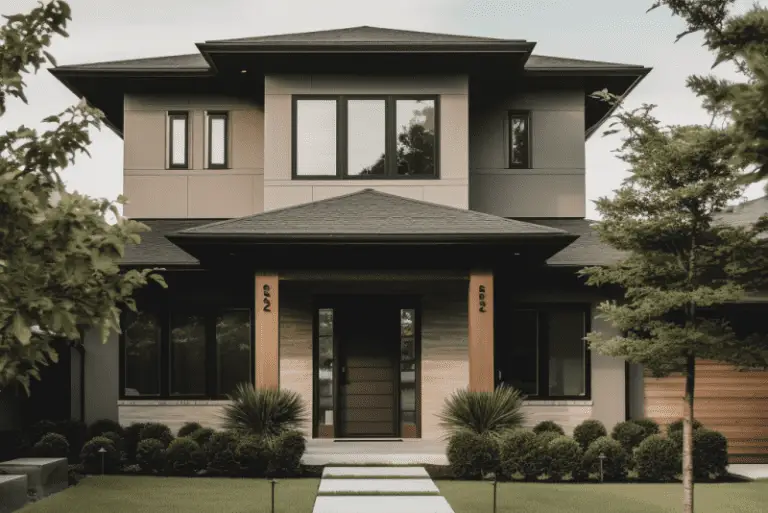 Modern two-story prairie home with tan and gray exterior, large windows and glass entrance.